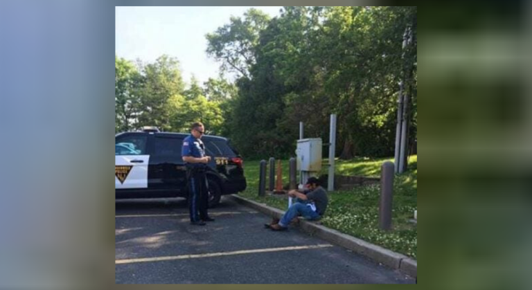 Homeless Man Sitting Alone On A Parking Lot Was Terrified After A Police Officer Approached Him. But The Reason For This Left Everyone Nearby Shocked